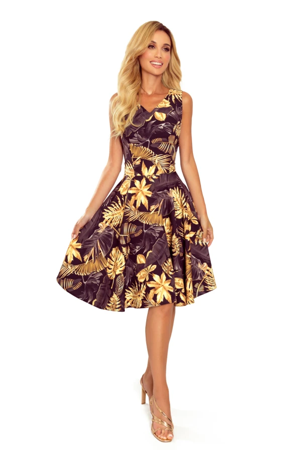 A flared dress with a vibrant floral and leaf pattern in shades of gold and brown, featuring a sleeveless design and a fitted waist. The dress exudes elegance and is perfect for both casual and formal occasions.