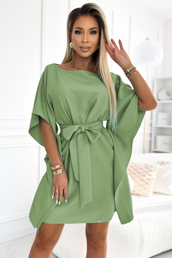 A stylish green dress with a butterfly sleeve design, featuring a waist tie for a flattering silhouette. The dress is perfect for both casual and elegant occasions, offering a blend of comfort and sophistication.