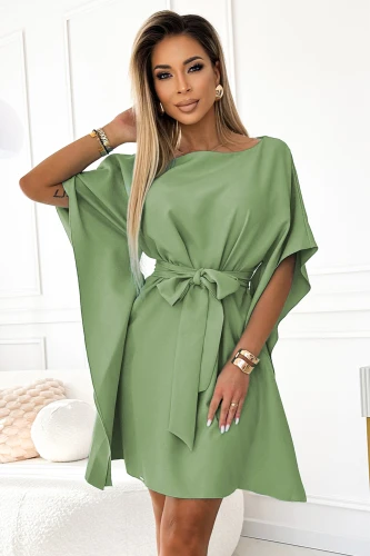A stylish green dress with a loose, flowing design and butterfly sleeves, perfect for a chic and comfortable look. The dress features a matching belt that accentuates the waist, adding elegance to its relaxed fit.}