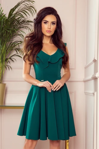 A stylish green dress featuring a fitted bodice with elegant ruffle detailing and a flared skirt. The sleeveless design and V-neckline add a touch of sophistication, perfect for both casual and formal occasions.}