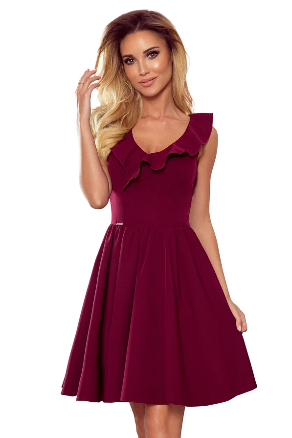 A burgundy dress with a fitted bodice and a flared skirt, featuring a stylish ruffle detail along the neckline. The sleeveless design and elegant cut make it perfect for both casual and formal occasions.