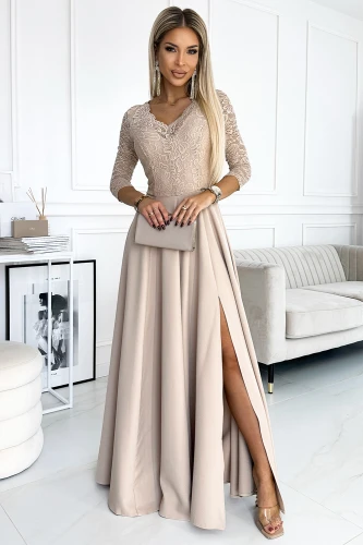 Elegant long beige lace dress with three-quarter sleeves and a V-neckline, featuring a high slit for a sophisticated look. Perfect for formal occasions, the dress is complemented by a matching clutch bag.}