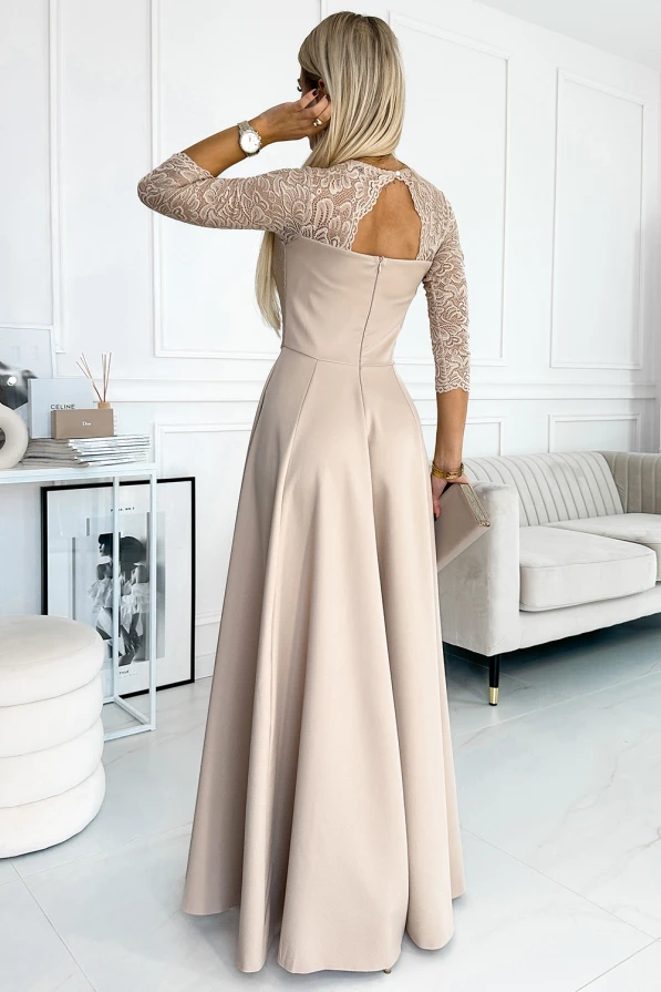 A long, elegant beige dress features intricate lace detailing on the sleeves and a sophisticated open back design. The flowing skirt adds a touch of grace, making it perfect for formal occasions.