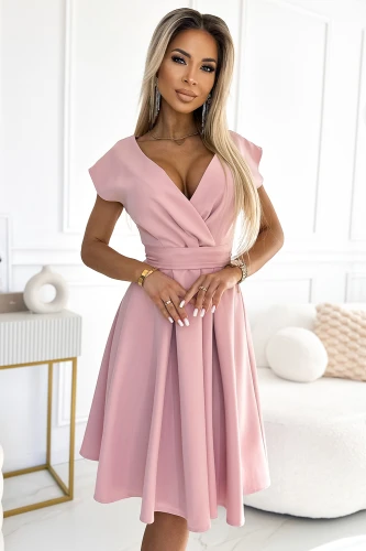 A stylish, flared pink dress with a wrap-style bodice and cap sleeves, perfect for elegant occasions. The dress features a fitted waist that accentuates the silhouette, creating a graceful and feminine look.}