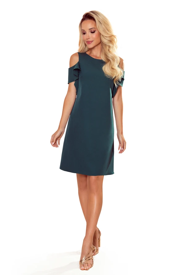 A chic, dark green trapeze dress featuring stylish cold shoulder cutouts and delicate ruffle details on the sleeves. The dress offers a relaxed fit, perfect for both casual and semi-formal occasions.