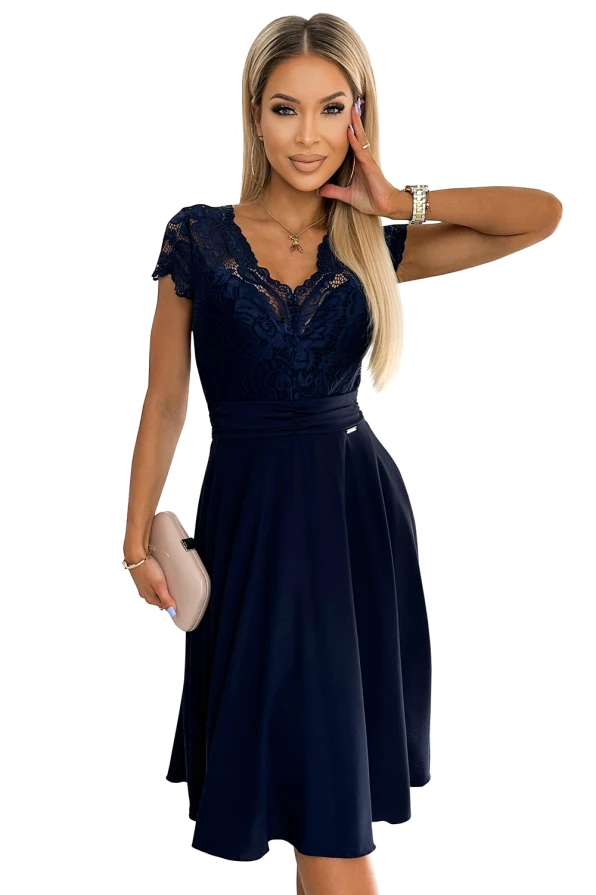 A navy blue chiffon dress featuring a delicate lace bodice and short sleeves, paired with a flowy A-line skirt. The elegant design is complemented by a subtle V-neckline and a fitted waist, perfect for formal occasions.
