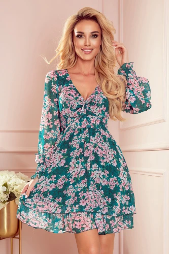 A floral chiffon dress with a vibrant green base and pink flower patterns, featuring a V-neckline and long, slightly puffed sleeves. The dress has a flowing, layered skirt that adds a touch of elegance and movement.}