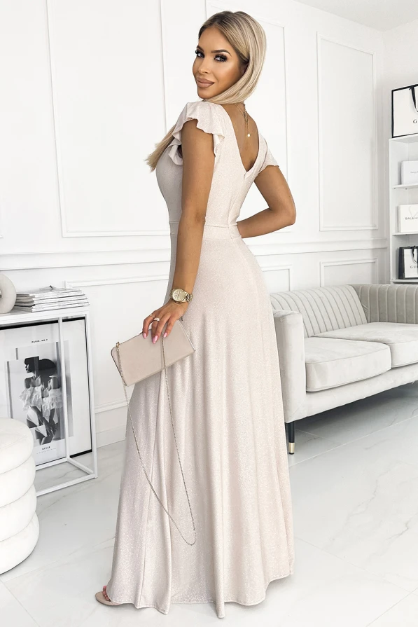 A shimmering, floor-length gown in a soft beige hue features delicate ruffled sleeves and a flattering V-neckline. The dress is complemented by a matching clutch, adding elegance to the overall look.