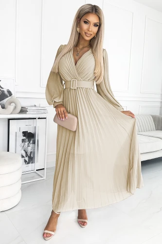 A beige pleated dress with long sleeves and a V-neckline is elegantly cinched at the waist with a matching belt. The flowing fabric and sophisticated design make it perfect for both formal and casual occasions.}