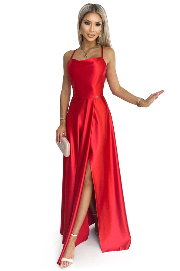 A long, elegant red satin dress with a fitted bodice and a high slit, perfect for formal occasions. The dress features thin straps and a flowing skirt, adding a touch of sophistication and glamour.