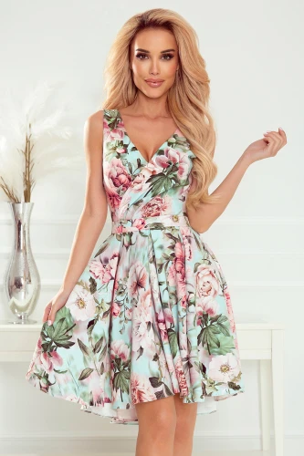 A floral dress with a fitted bodice and a flared skirt, featuring a vibrant pattern of pink and green flowers on a light background. The sleeveless design and V-neckline add a touch of elegance, perfect for spring or summer occasions.}
