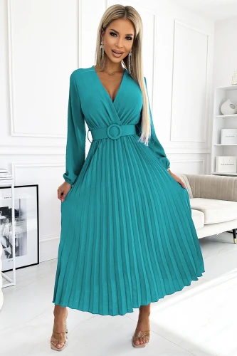 A teal pleated dress with long sleeves and a V-neckline is elegantly cinched at the waist with a matching belt. The dress exudes sophistication, perfect for both formal and casual occasions.}