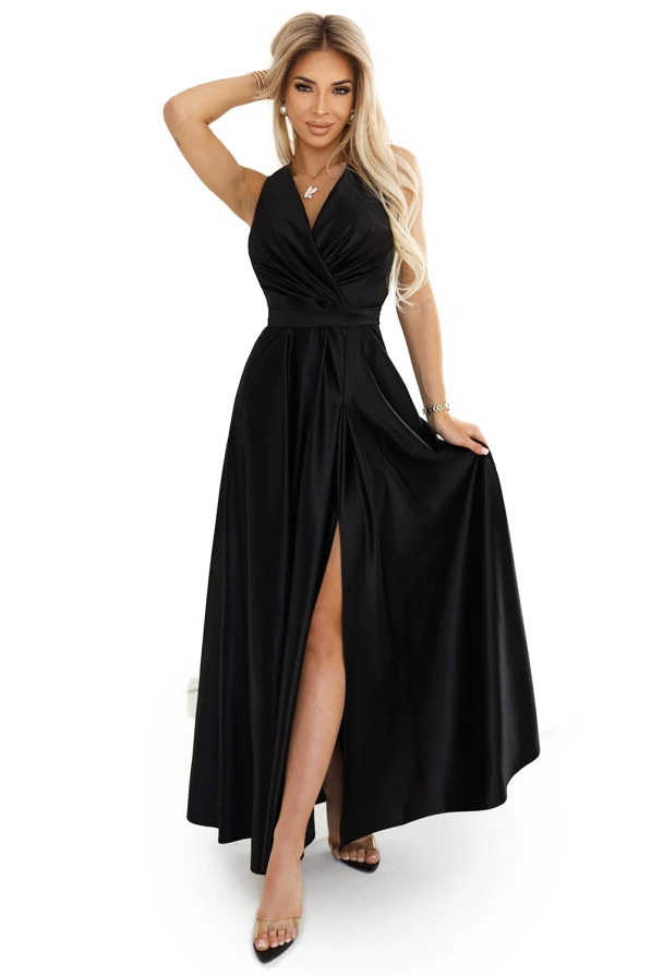 Elegant black evening gown with a deep V-neckline and a high slit, crafted from luxurious, flowing fabric. The dress features a fitted waist and a floor-length skirt, perfect for formal occasions.